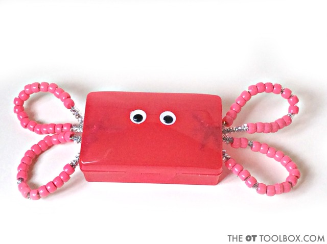 Use beads and a travel soap holder to make a fine motor craft that builds skills kids need.