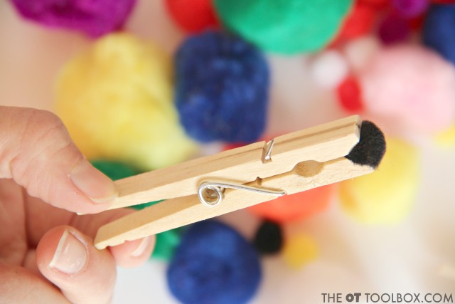 Kids love this fine motor activity that is so easy to set up and strengthen the hands, using just a clothes pin and craft pom pom.